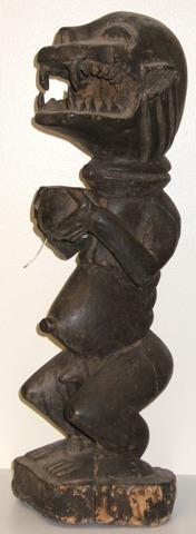 yoruba, nigeria, a carved wooden figure of a monkey